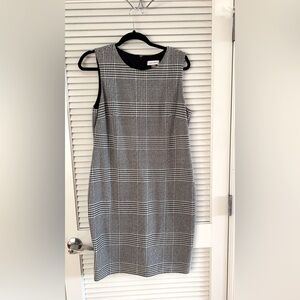 Black and white fitted sheath dress, lined, very comfortable. Good condition.